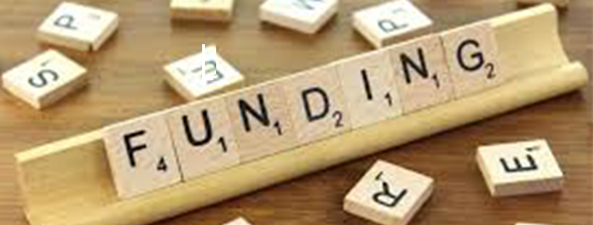 Scrabble blocks spell 'funding'