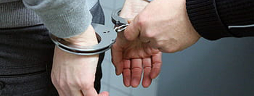 Youth wearing handcuffs