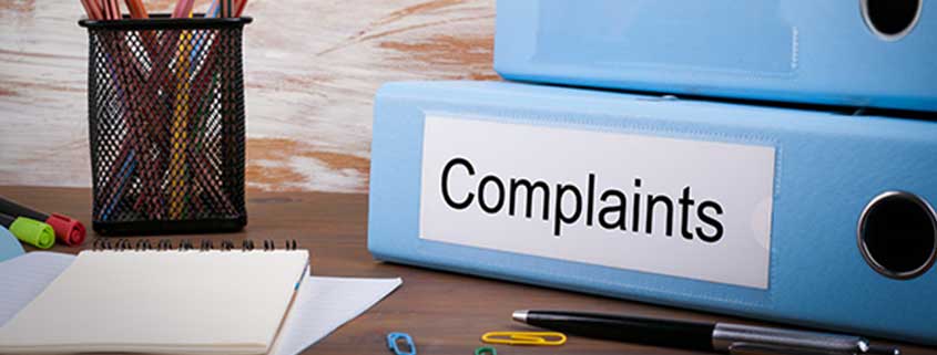 complaints folders on a desk